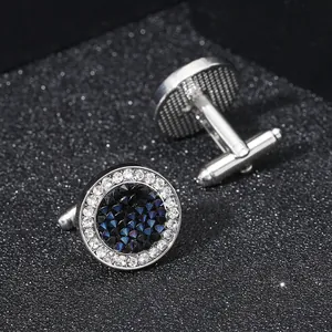 Gemelli rotondi in argento con cristalli bianchi scintillanti e pietre centrali blu scuro