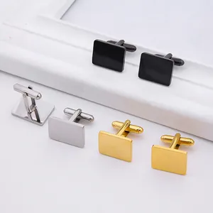 Detailed view of polished men's cufflinks in black, silver, and gold stainless steel