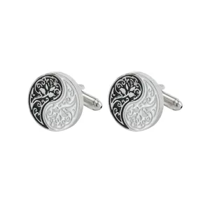 Pair of silver cufflinks featuring round Yin Yang Tai Chi design with Tree of Life patterns