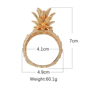 Detailed view of golden pineapple napkin ring with exact dimensions and weight specifications