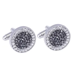 Gemelli tondi in argento con cristallo scuro centrale e pavé di strass bianchi luccicanti