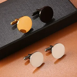 Close-up of polished round stainless steel cufflinks in gold, silver and black metal