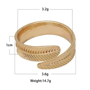 Detailed view of golden feather napkin ring showing 1cm width and 14.7g weight