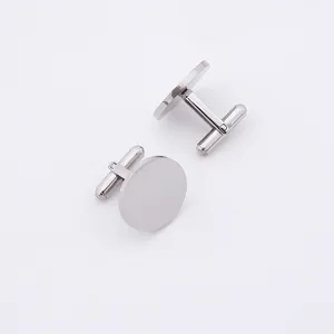 Close-up of polished silver round cufflinks with high-gloss finish and T-bar closure