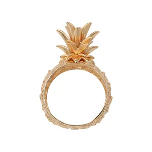 Elegant gold pineapple napkin ring with textured tropical fruit design for hotel dining