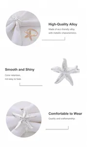 Macro view of crystal-studded starfish napkin rings in polished gold and silver alloys