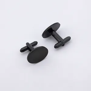 Close-up of polished black stainless steel cufflinks with classic T-shaped toggle closure