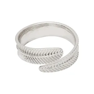 Elegant silver feather napkin ring with intricate textures for formal table settings