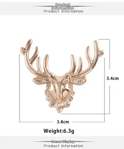 Detailed macro view showing the 3.8cm golden elk head brooch with polished metal finish