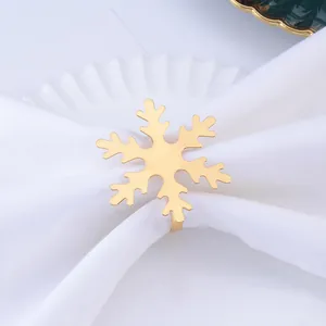 Elegante servilletero de metal con copo de nieve dorado para decoración festiva