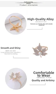 Detail of gold maple leaf napkin ring with sparkling crystals and white pearl accents