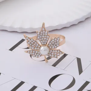 Elegant maple leaf napkin ring with gold plating, sparkling rhinestones and white pearl
