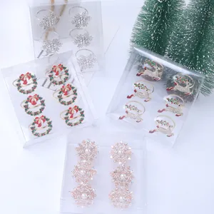 Detail of Christmas napkin ring set with snowflake, wreath and reindeer designs