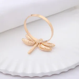 Elegant gold dragonfly metal napkin ring holder for hotel dining and wedding table decor