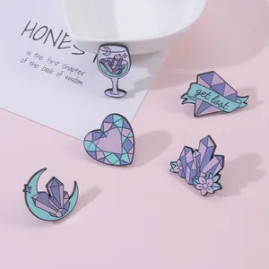 Dreamy purple crystal enamel pin set with wine glass and moon on soft pink background