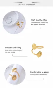 Detail of creative shell napkin ring in gold alloy finish with smooth polished texture