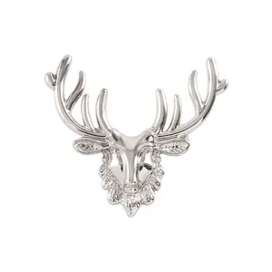 Elegant vintage silver reindeer head brooch with detailed antlers for suit lapels