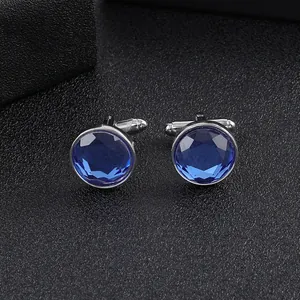 Classic silver round cufflinks with deep blue faceted crystal stone for formal wear