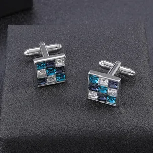 Detail of square cufflinks with blue and white zircon stones in a 3x3 matrix setting