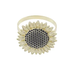 Elegant gold sunflower napkin ring with metal petals and textured center for table decor