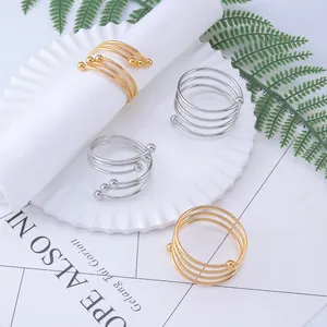 Elegant spiral metal napkin rings in gold and silver finish for wedding table decor