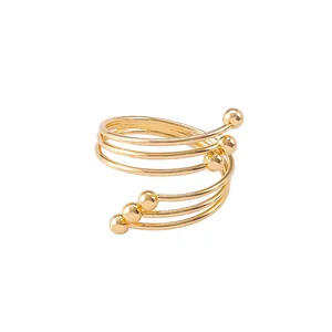 Elegant gold spiral multi-layer napkin ring with metallic beads for dining table decor