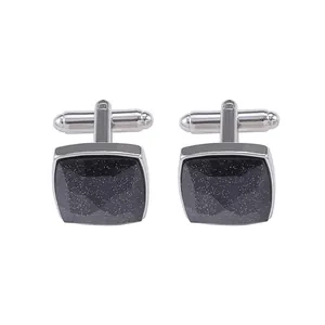 Pair of square cufflinks with dark starry stones and polished silver metal finish