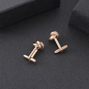 Elegant rose gold twisted rope cufflink pair for men with a polished metallic finish