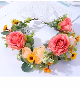 Close-up of handmade bridal flower crown with pink roses and adjustable white silk ribbon