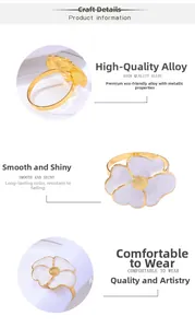 Detail of daisy flower napkin ring with white petals and gold alloy finish on a napkin