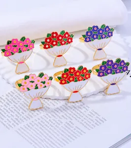 Detail view of rose bouquet alloy napkin rings in pink, red and blue floral styles