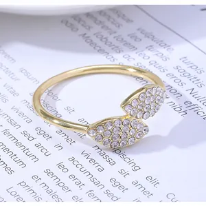 Macro detail of golden clover napkin ring with sparkling rhinestones on leaf pattern