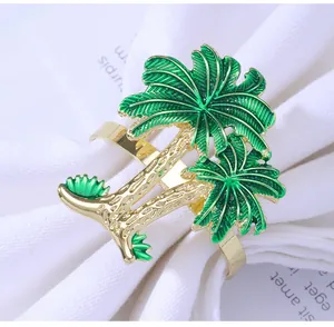 Detailed macro view of tropical gold palm tree napkin ring with green enamel palm leaves
