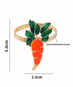 Close-up of carrot napkin ring with gold metal base and orange enamel finish