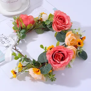 Pink rose and yellow sunflower bridal flower crown with green leaves and white ribbon