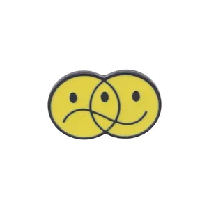 Yellow enamel pin with unique double circle smiley face design in polished alloy finish