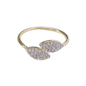 Elegant gold clover leaf napkin ring with sparkling rhinestones for table settings