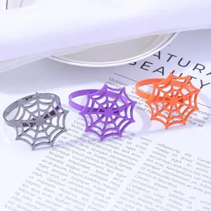 Halloween spider web napkin rings in silver, purple, and orange for table decor