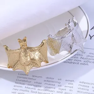 Gothic bat metal napkin rings in gold and silver finishes for Halloween table decor