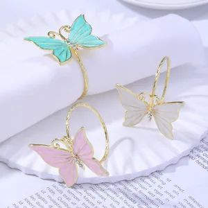 Elegante juego de servilleteros de mariposa con alas de esmalte de colores y oro