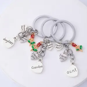 Polished silver alloy keychains with red enamel roses and heart charms for family gifts