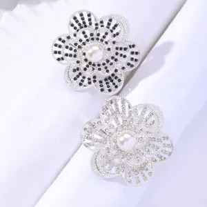 Elegant floral metal napkin ring with white pearls and sparkling rhinestones for table decor