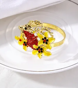 Detail of Christmas reindeer napkin ring with gold alloy and red rhinestone leaves