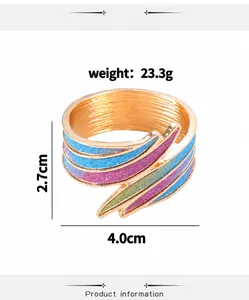 Detail of gold metal napkin ring with colorful glitter stripes and size measurements