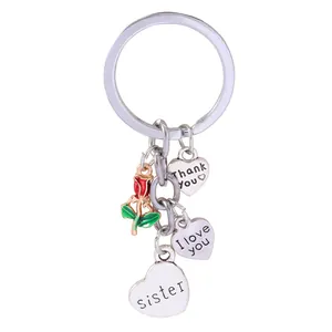 Silver metal keychain with red enamel rose and heart pendants engraved with I Love You
