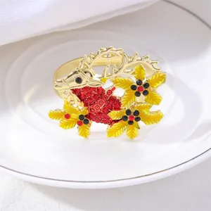 Golden Christmas reindeer napkin ring with red rhinestones and yellow enamel leaves