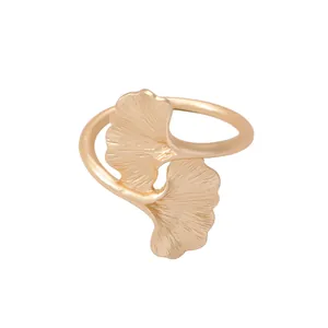 Golden ginkgo leaf napkin ring with vintage matte texture and intricate vein details