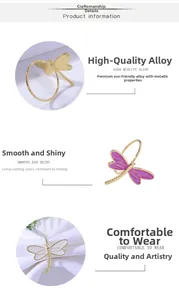 Detailed close-up of colorful enamel dragonfly napkin rings in gold and purple finishes