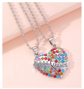 Close-up of heart puzzle necklace set with colorful rhinestones and Best Friends engraving