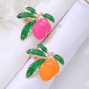 Modern tropical mango fruit napkin rings in pink and orange enamel on gold alloy base